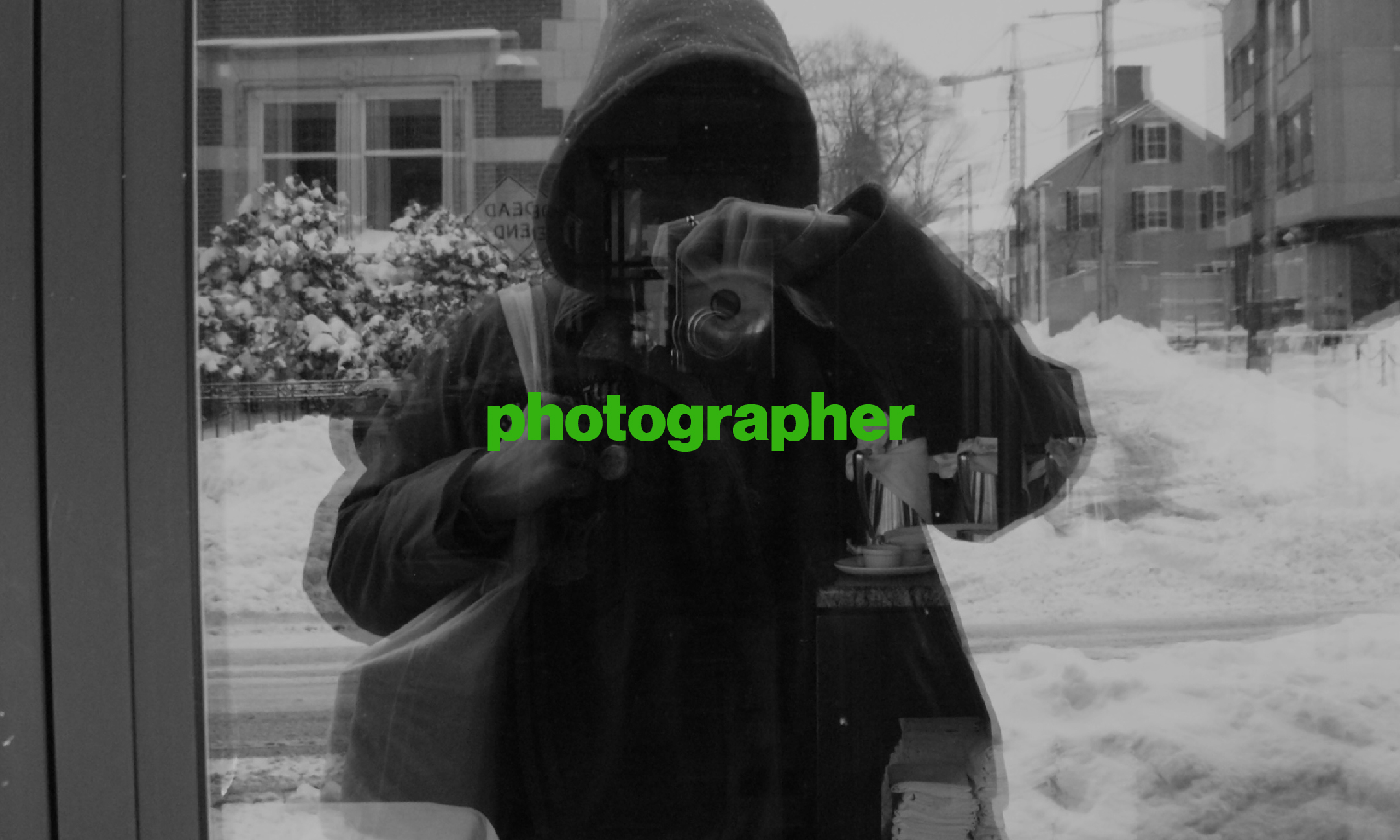 A black and white photo of an espresso cup featuring the word 'Bloom' on it.